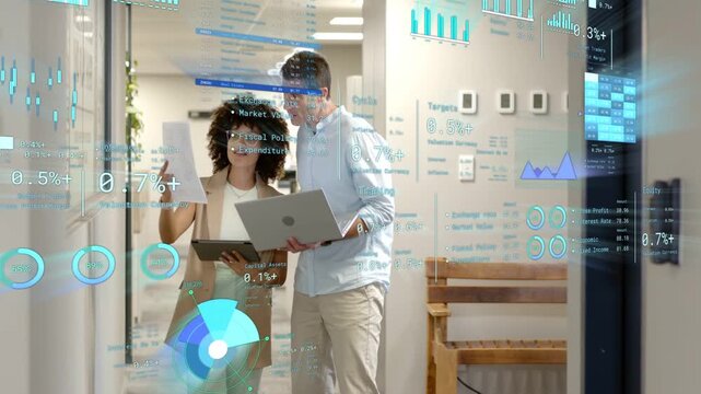 Woman and man pausing by glass, comparing paper and laptop to align business charts overlaying view