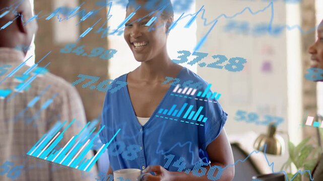 Team discussing finance, woman holding mug laughing while man speaking causing blue charts drifting