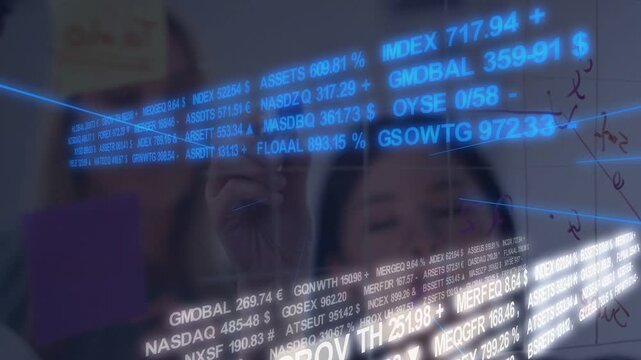 Analyst lifting marker and writing on glass as holo finance ribbon streaming ticker, team deciding