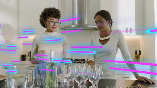 Two women arranging glasses on island, hugging, using phone while preparing table, glitch passing