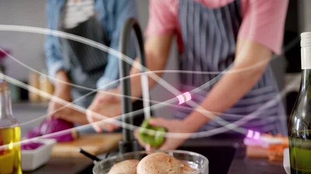 Woman turning faucet, rinsing pepper as man cutting cabbage, moving light streaks guiding cooking