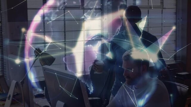 Seated dev using PC initiating tech hologram forming around while peer watching for review