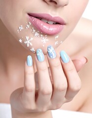 Fototapeta premium A woman's face with snowflakes on her chin and manicured nails