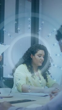 Vertical video: Woman taking paper on cue in business meeting while HUD annotating data for notes