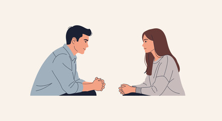 Obraz premium Two people facing each other and talking in a conversational setting, representing discussion and communication