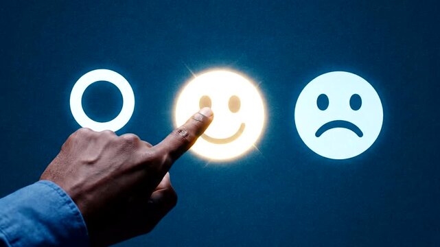 Customer feedback concept with finger selecting happy face icon.