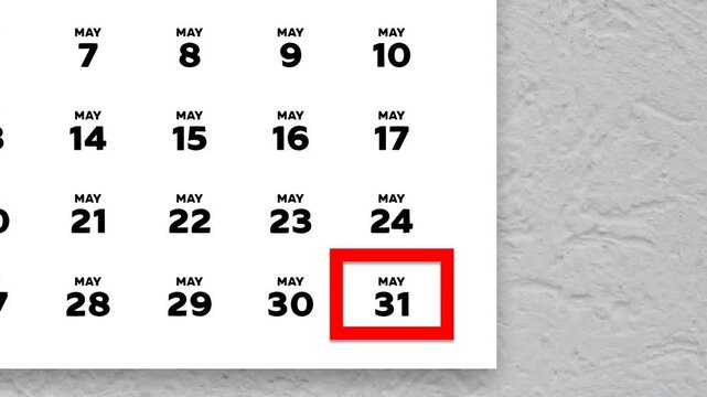 May 31st marked with a red cursor on the wall calendar 2026
