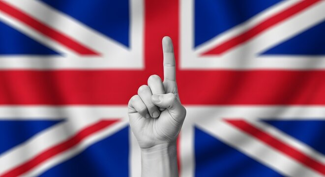 A hand pointing upwards in front of a British flag, symbolizing unity or being number one.