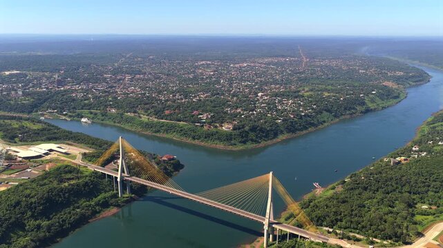 Aerial drone view of a cable-stayed bridge (Puente de la Integraci&oacute;n) over the Parana River at the Triple Frontier of Brazil Argentina and Paraguay.