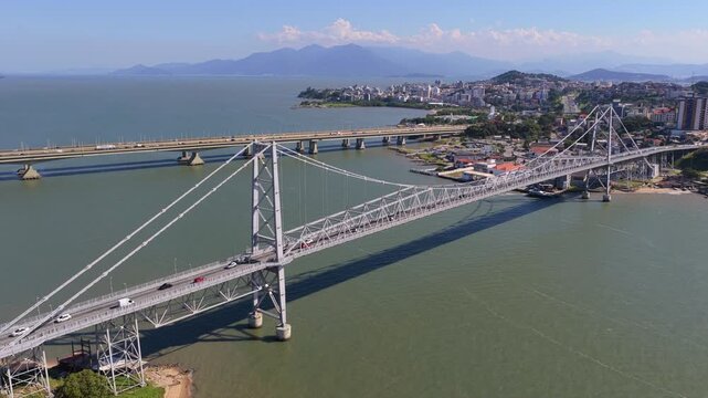 Aerial view of Hercilio Luz Bridge and Florianopolis cityscape, Brazil, iconic suspension bridge connecting island to mainland.