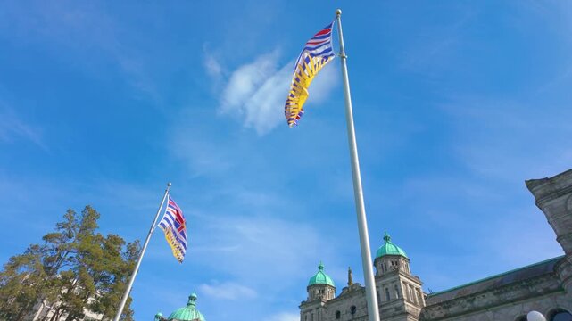 Victoria, BC, Canada &ndash; April 19, 2026: British Columbia flags at Parliament Buildings