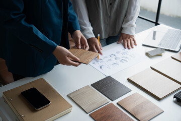 Interior Designer Consulting with Client on Material Selection © Wanda