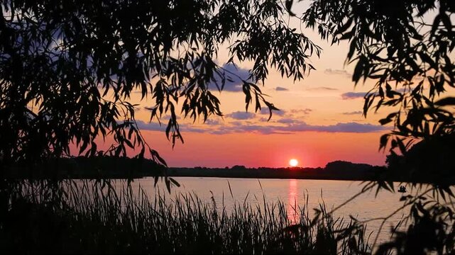 Beautiful sunset on the lake in Ukraine during summer