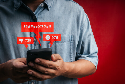 Cyberbullying and online harassment concept with smartphone and negative social media reactions. Toxic comments, hate speech, internet trolling and digital impact on mental health in communication.