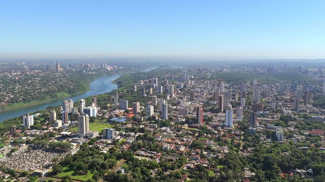 Panoramic aerial drone view of Foz do Iguacu city in Parana state, Brazil, with Paraguay visible across the river.