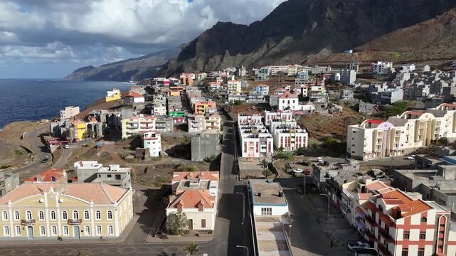 Ponta do Sol town on the coast of Santo Antao, Cape Verde. Drone footage showing colorful colonial architecture, urban density, and the atlantic ocean shore at the mountains