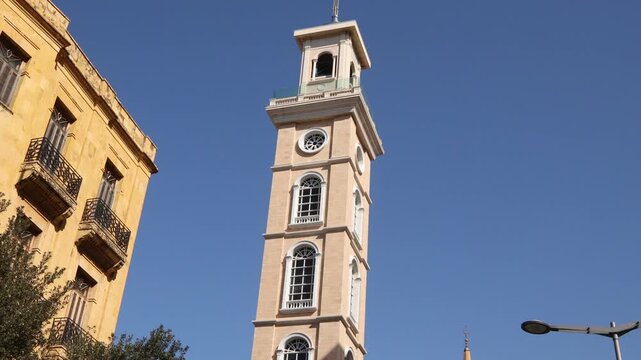 Low angle shot of the historic Saint George Greek Orthodox Cathedral bell tower in downtown Beirut. Traditional religious architecture in the heart of the Lebanese capital center
