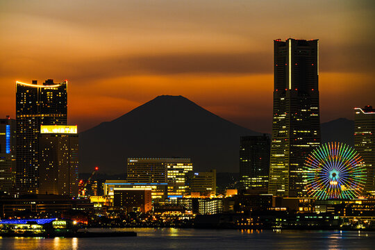 Panoramic cityscape of Yokohama Minato Mirai skyline at sunset with Mount Fuji in the background, Kanagawa, Japan.
