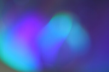 Fototapeta premium Blur colorful rainbow crystal light leaks on black background. Defocused abstract multicolored retro film lens flare bokeh analog photo overlay or screen filter effect. Glow Vintage prism colors