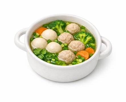 Healthy clear soup with fish balls, minced pork, broccoli, and carrots in a white bowl. Fresh and nutritious homemade Asian style meal isolated on white.