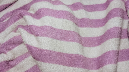 Soft pink and white striped fabric texture. © HeyKun