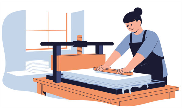 A woman using a manual press machine to flatten and shape paper sheets in a workshop