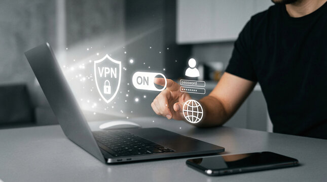 Cybersecurity Concept Person Turning On VPN Shield Interface on Laptop with Futuristic Hologram