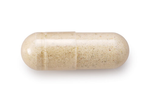 Macro shot of a single transparent capsule filled with herbal supplement powder, isolated on white background
