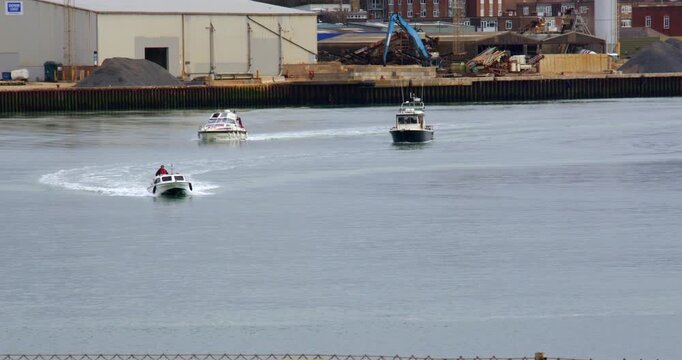 Wide Shot of Three boats leaving Shoreham Harbour