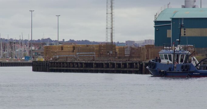 shot of a tugboat entering Shoreham harbour