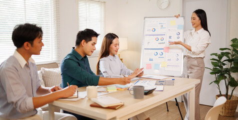 Fototapeta premium Business colleagues presenting data charts in a meeting