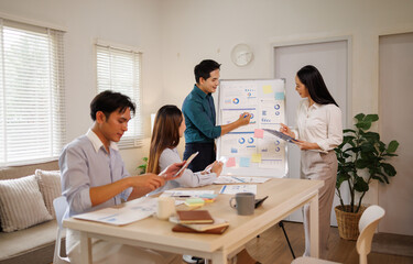 Fototapeta premium Business people having team meeting discussing data analysis