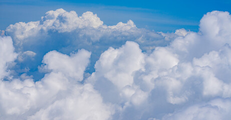 Clouds on blue sky. Soft clouds on the sky background. Fluffy clouds in the sky. Calm clouds.