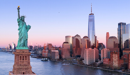 Manhattan with towers and Liberty Statue. NYC city panorama with Statue of Liberty. New York skyline at Statue of Liberty. American Independence Day. NYC with World Trade Center and Statue of Liberty. © Volodymyr