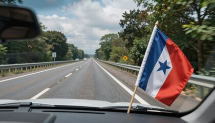 Fototapeta premium Driving on Highway with Costa Rican Flag on Car Dashboard - Summer Road Trip Adventure