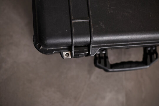 Protective hard-shell carry-on case designed for secure transport of sensitive equipment during air travel. Durable travel suitcase with reinforced interior compartments for safe storage of profession