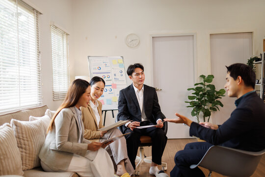 Business team discussing project strategy during office meeting