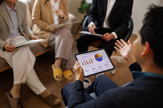 Business team analyzing data during an informal meeting
