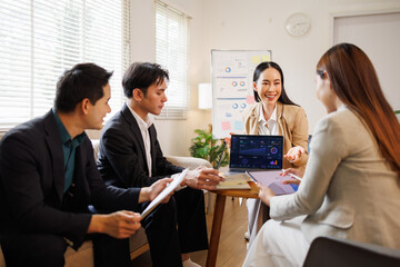 Business team analyzing data during marketing presentation meeting