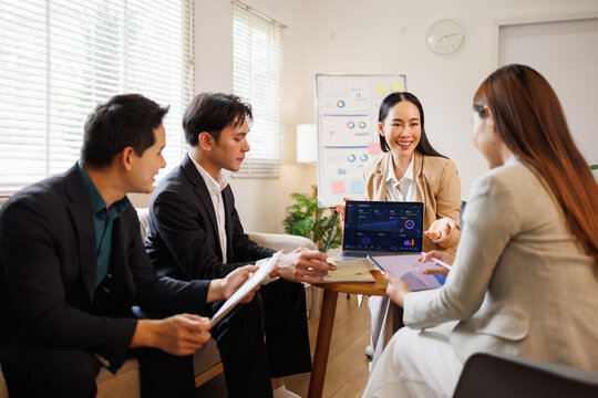 Business team analyzing data during marketing presentation meeting