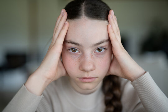 Portrait of teenage girl struggling with emotions.
