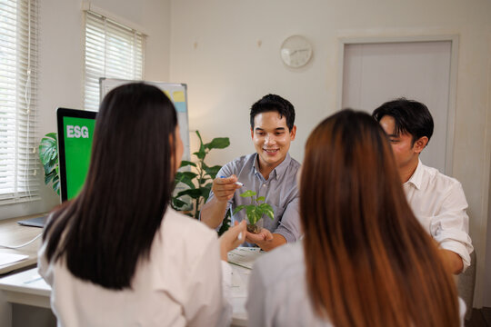 Business people discussing esg investing and sustainability goals