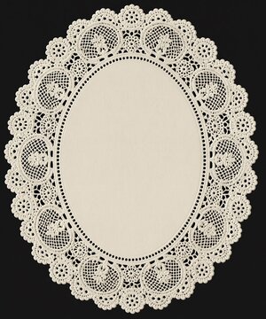 Vintage oval lace doily frame with intricate crochet pattern on black background, featuring blank center for text or design and elegant retro craft decoration.
