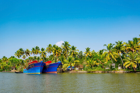 Kerala backwaters, India. Fishing boats on the canals