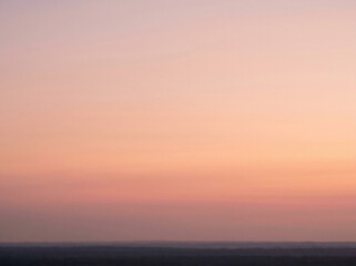 Obraz premium Serene Sky's Gradient Canvas: Witness the artistry of nature as the sky transitions through soft hues, creating a mesmerizing gradient canvas of colors. A moment of pure tranquility.