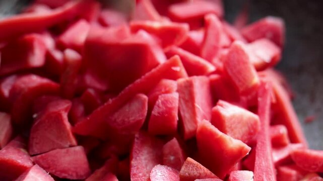 Close-up of chopped carrots prepared for cooking gajar ka halwa. Fresh ingredients, traditional Indian food preparation, kitchen process, rural lifestyle, poverty, slum village poor india concept.  
