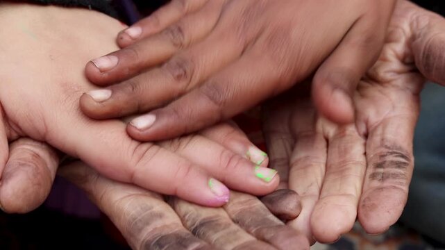 Close-up of multiple Indian village family hands stacked together, symbolizing unity, care, and generational connection. A powerful rural lifestyle image reflecting support, love, and togetherness in 
