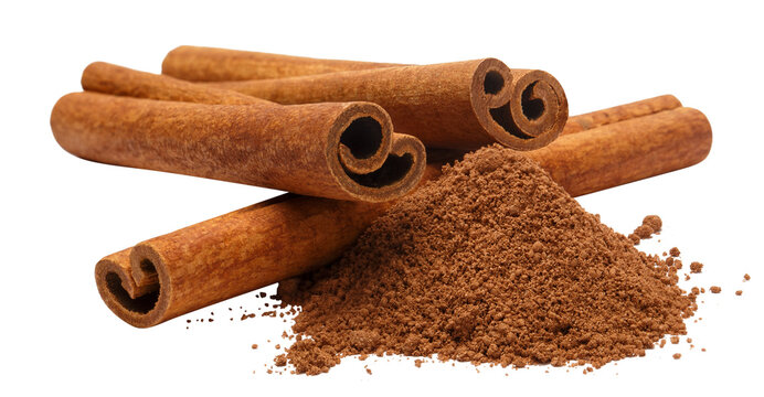 Cinnamon sticks with ground cinnamon pile showing rich texture and warm tones, isolated on cutout transparent background