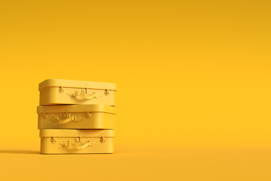 Yellow luggage stack ready for travel and vacation