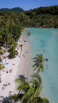 Discover the breathtaking beauty of Koh Kood, Thailand, where soft white sands meet tranquil turquoise waters.